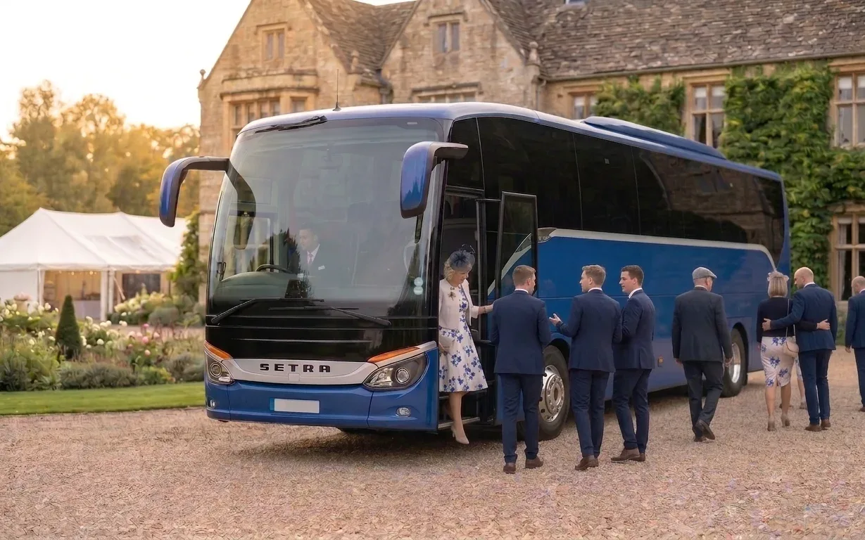 Wedding guests boarding a coach at the venue